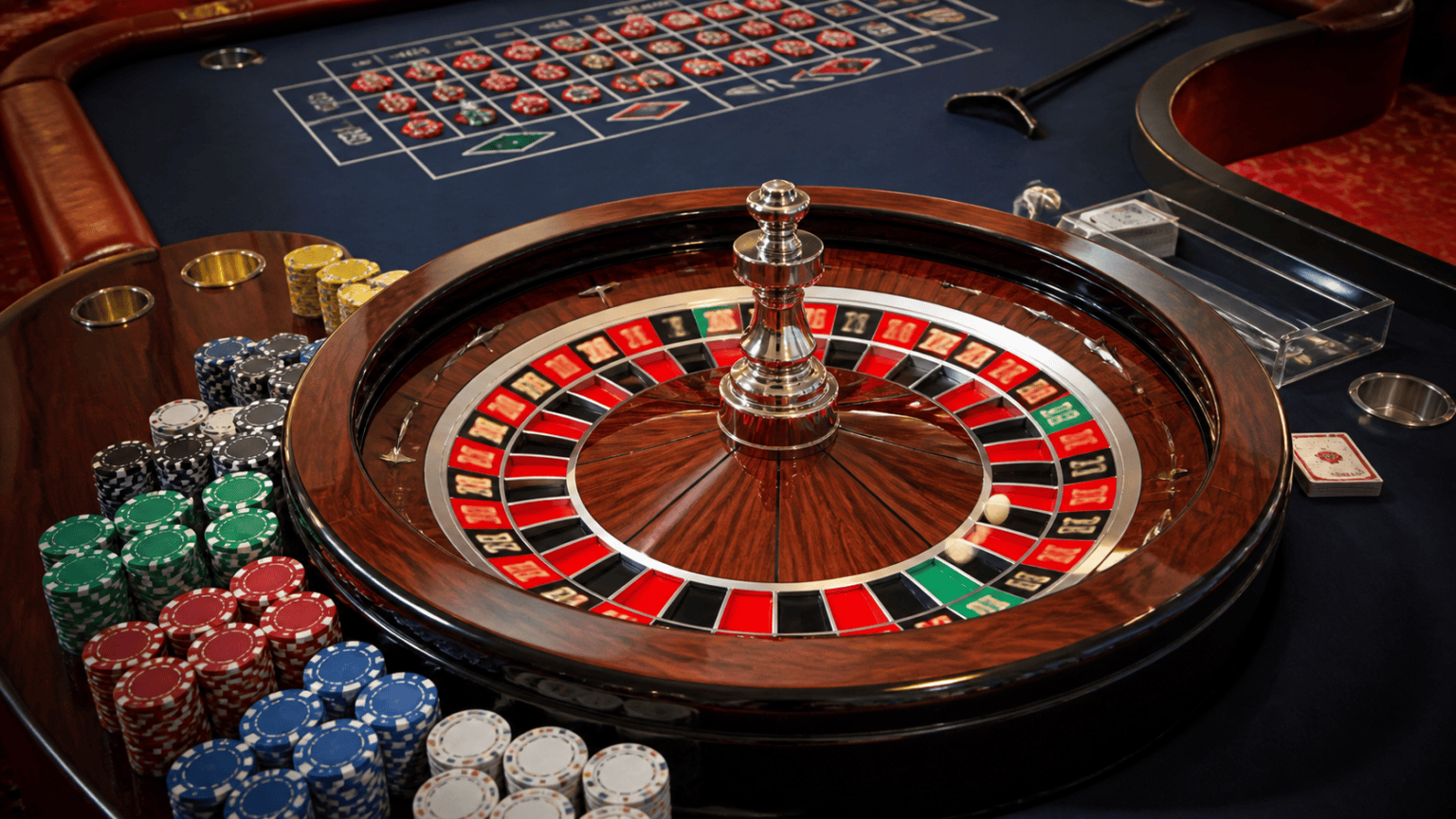 What Makes Online Casino Play Attractive to Malaysian Players: online casino malaysia Casino table with chips, cards, and roulette wheel